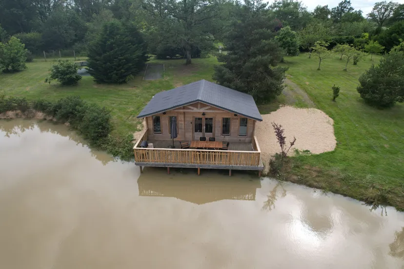 Rent a private pond with chalet and a terrace suspended on the water