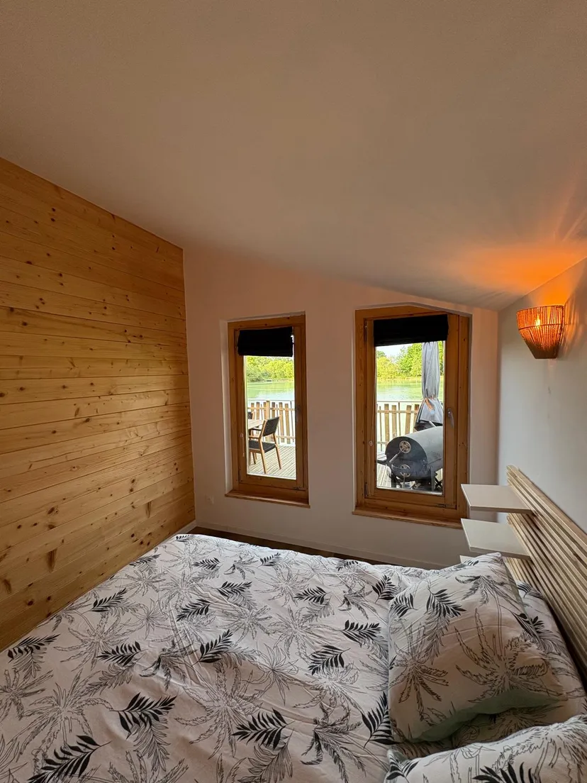 Rent a private pond with chalet and a terrace suspended on the water